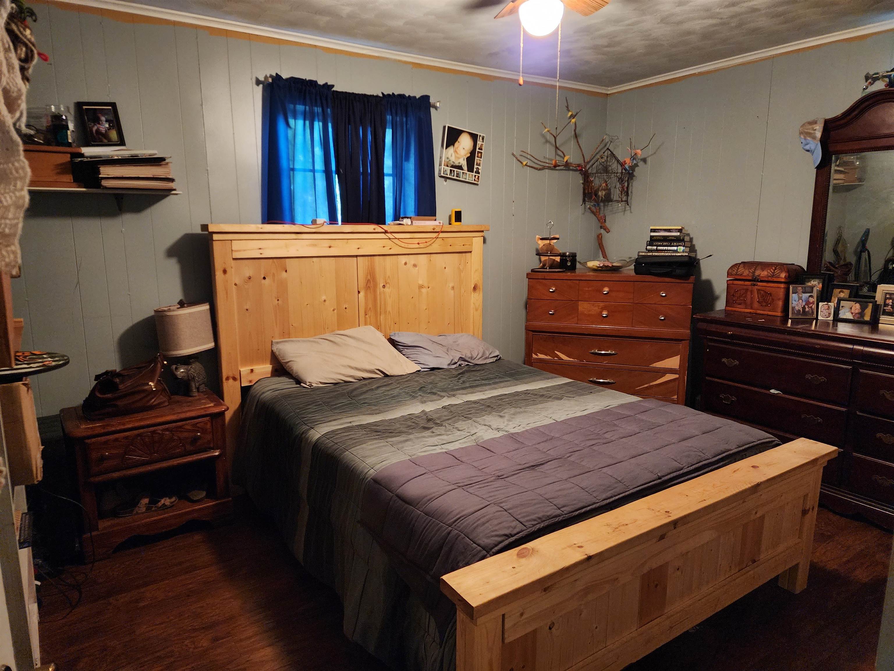 1607 Curve Nankipoo Road Ripley, TN 38063 - Photo 5 of 8 a bedroom with a bed and a chandelier