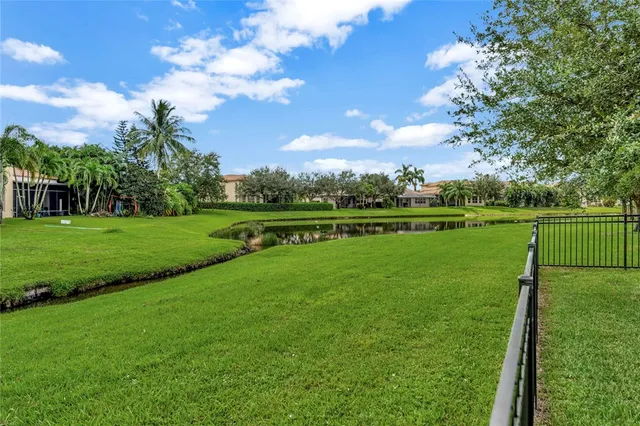 a view of a golf course with a lake