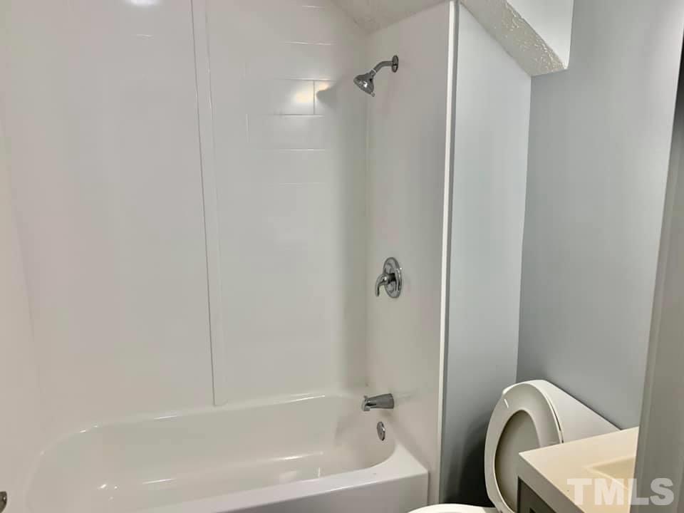 71 Gentry Dunkley Road Roxboro, NC 27574 - Photo 7 of 14 a bathroom with a tub and sink