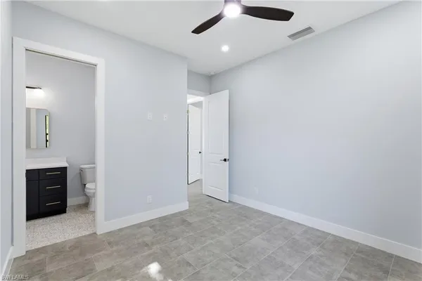 an empty room with a bathroom