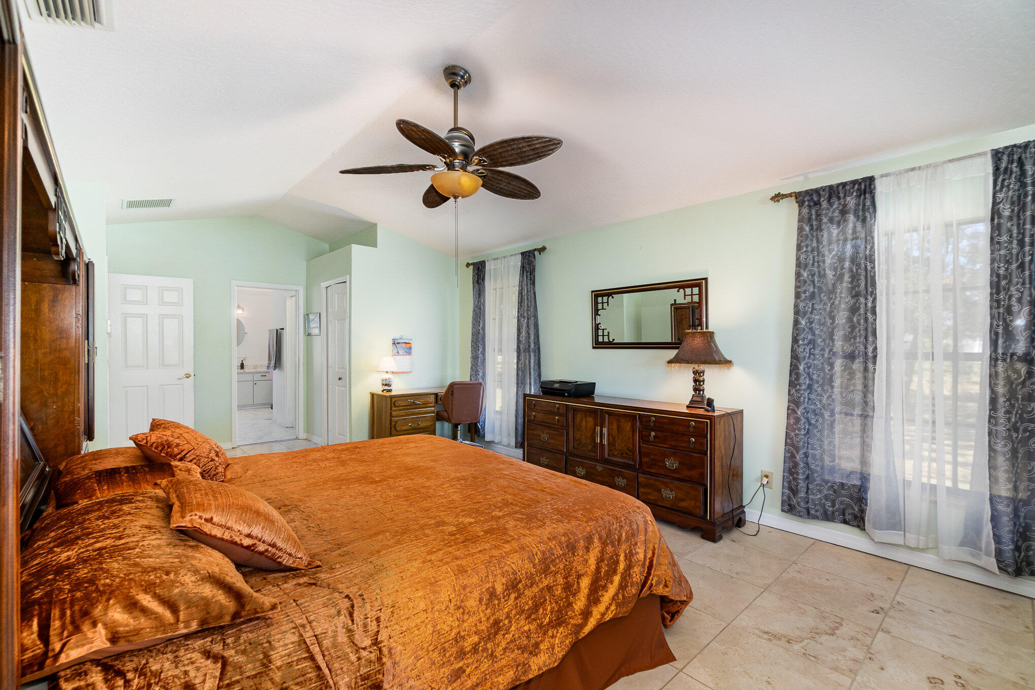 234 Deer Run Road Palm Bay, FL 32909 - Photo 18 of 50 a bedroom with a bed and a flat screen tv