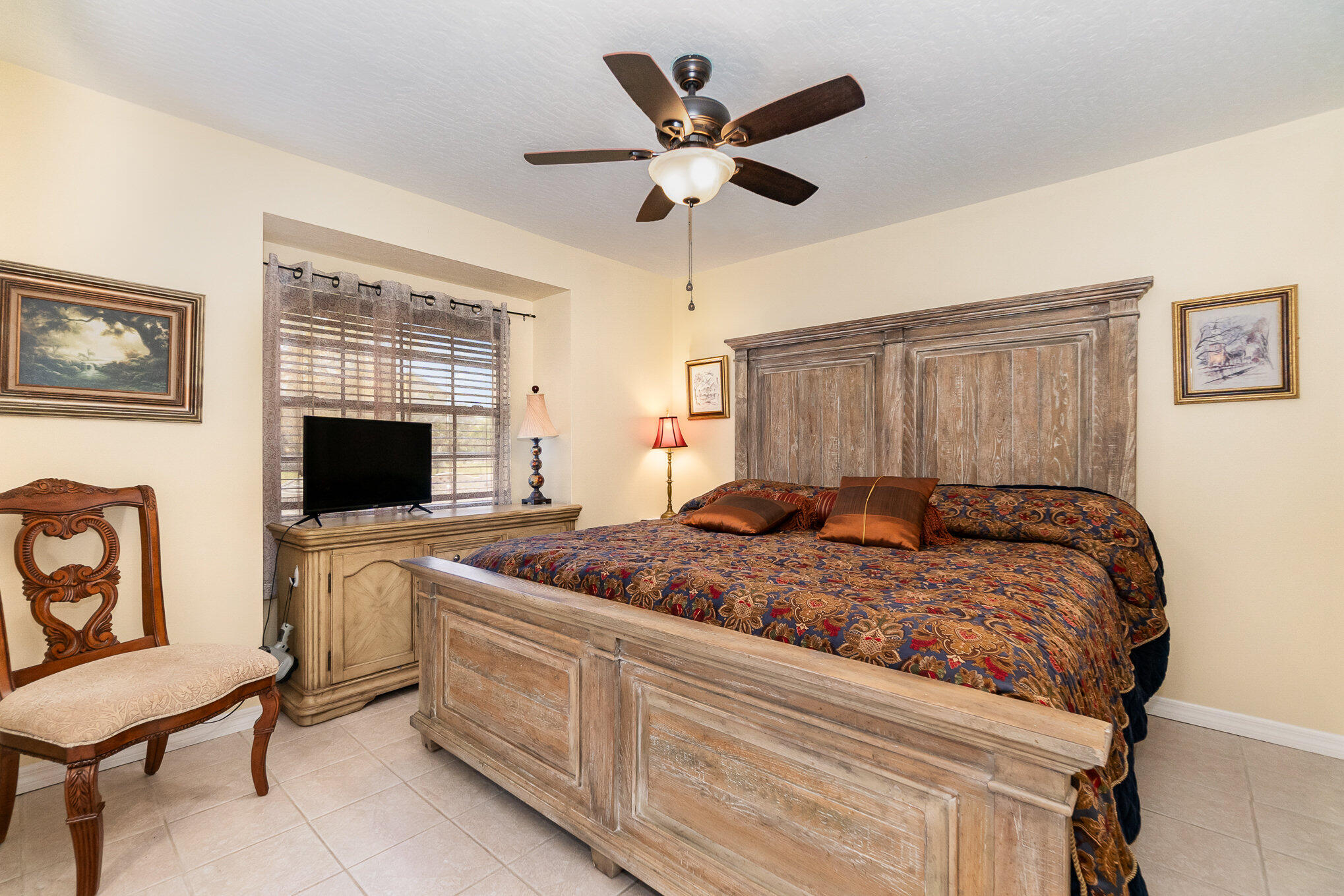 234 Deer Run Road Palm Bay, FL 32909 - Photo 21 of 50 a living room with furniture and a flat screen tv