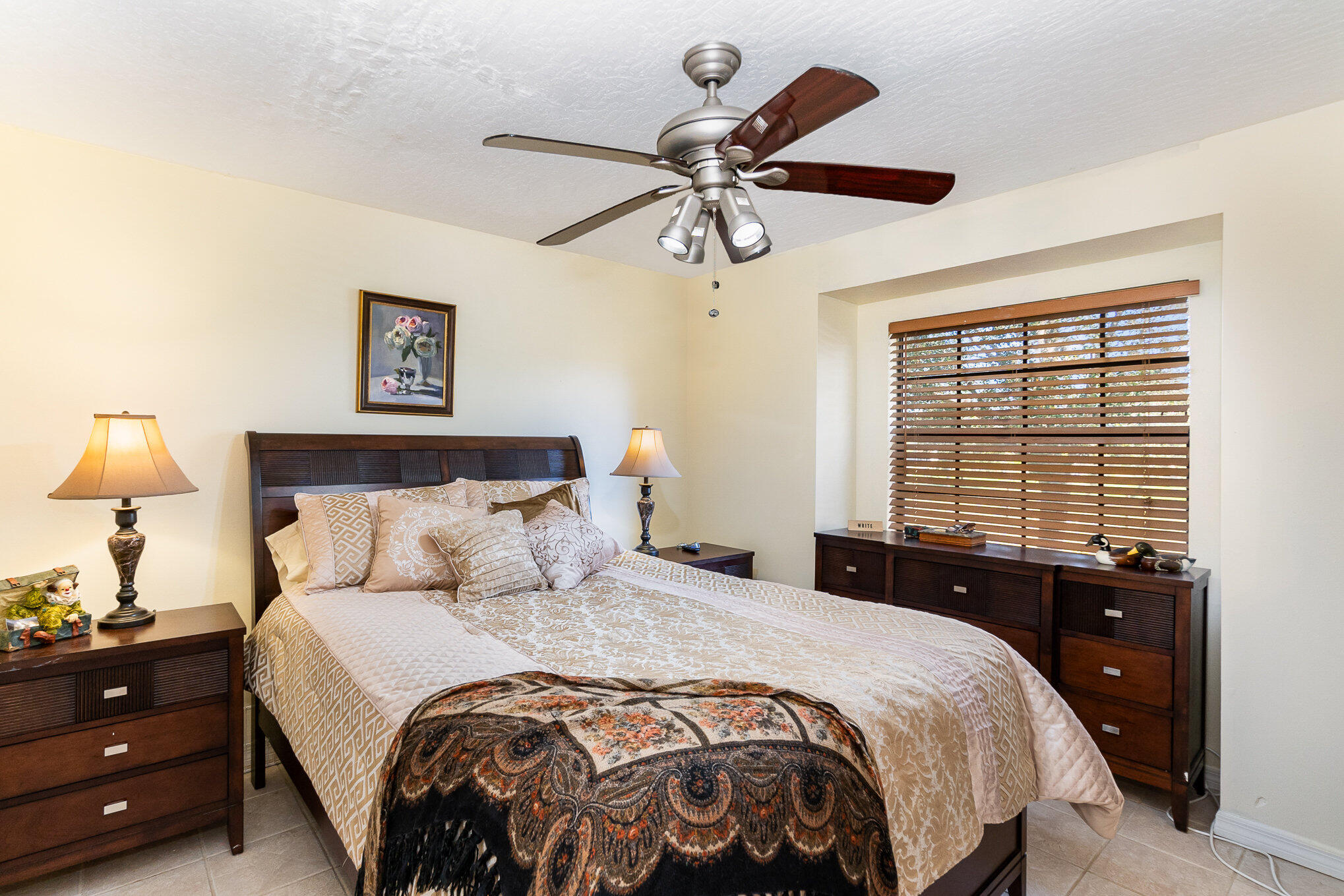 234 Deer Run Road Palm Bay, FL 32909 - Photo 23 of 50 a bedroom with a bed and a chandelier