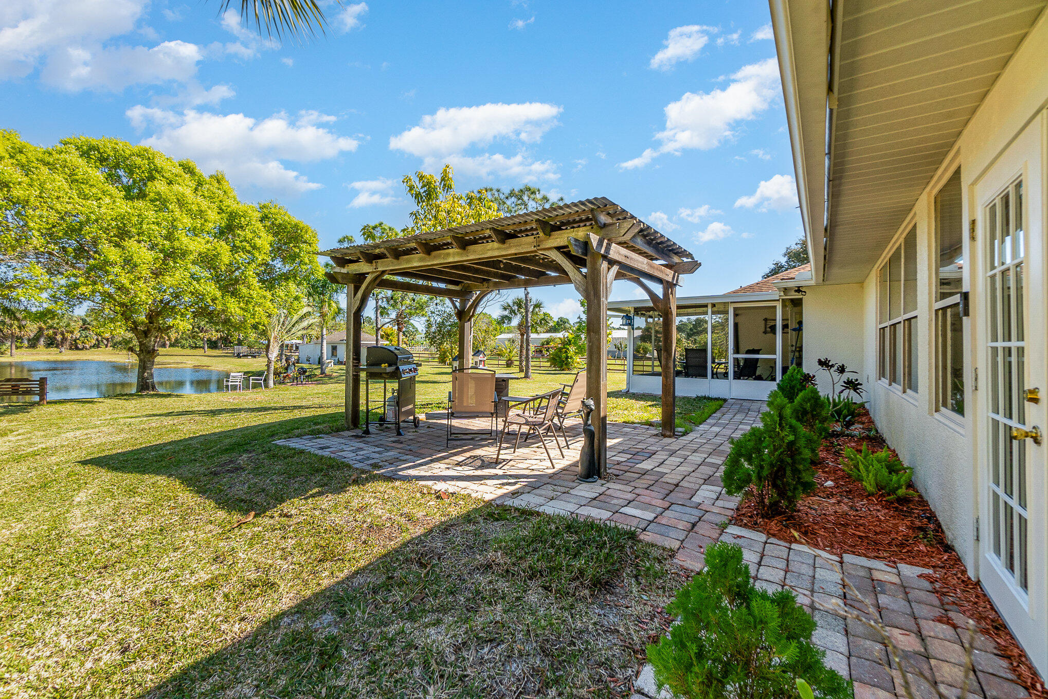 234 Deer Run Road Palm Bay, FL 32909 - Photo 29 of 50 a view of a house with backyard and sitting area