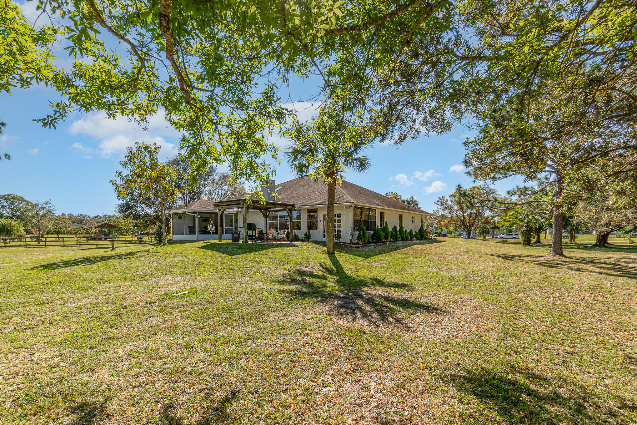 234 Deer Run Road Palm Bay, FL 32909 - Photo 30 of 50 a swimming pool with trees in the background