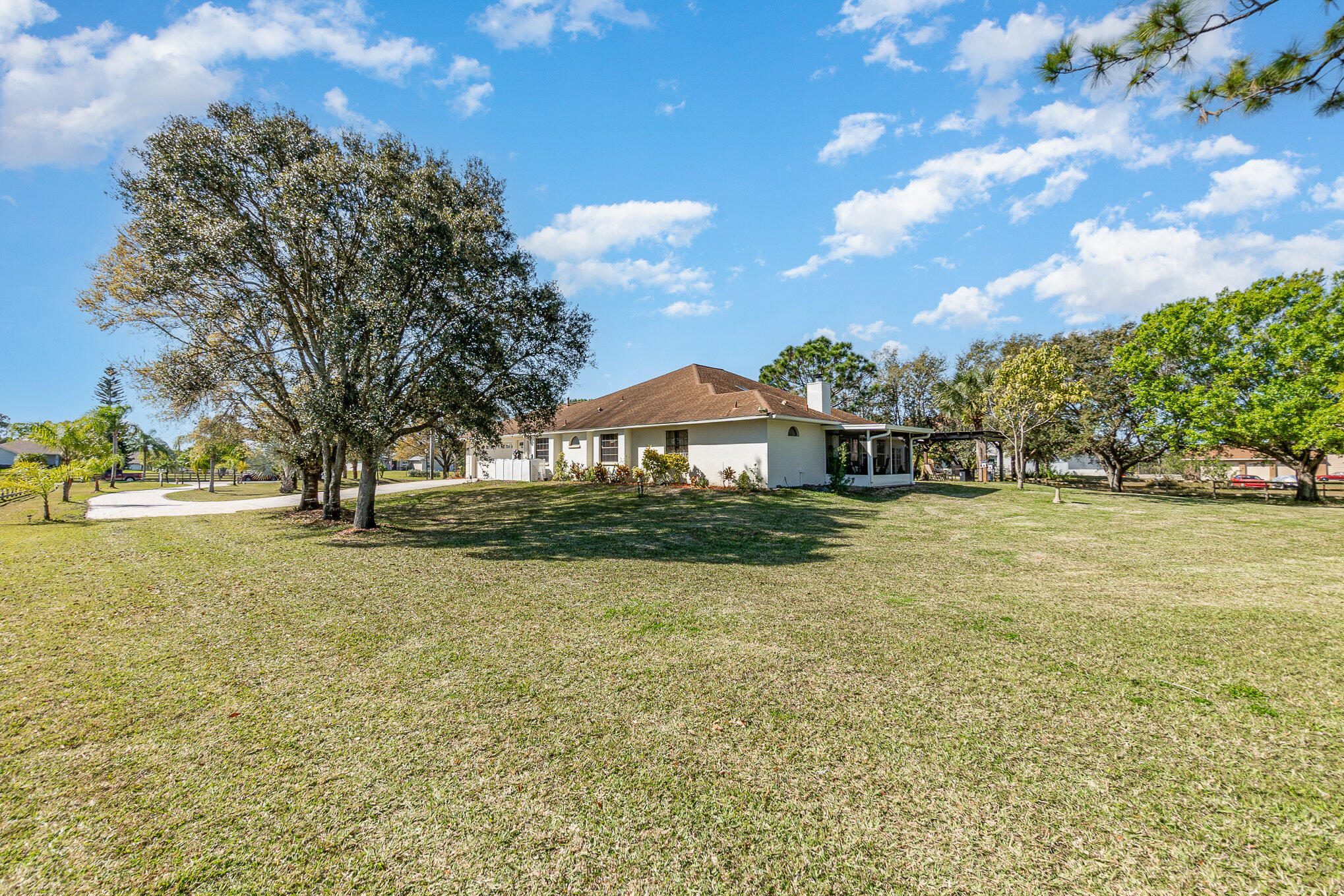 234 Deer Run Road Palm Bay, FL 32909 - Photo 31 of 50 a front view of a house with a yard and trees