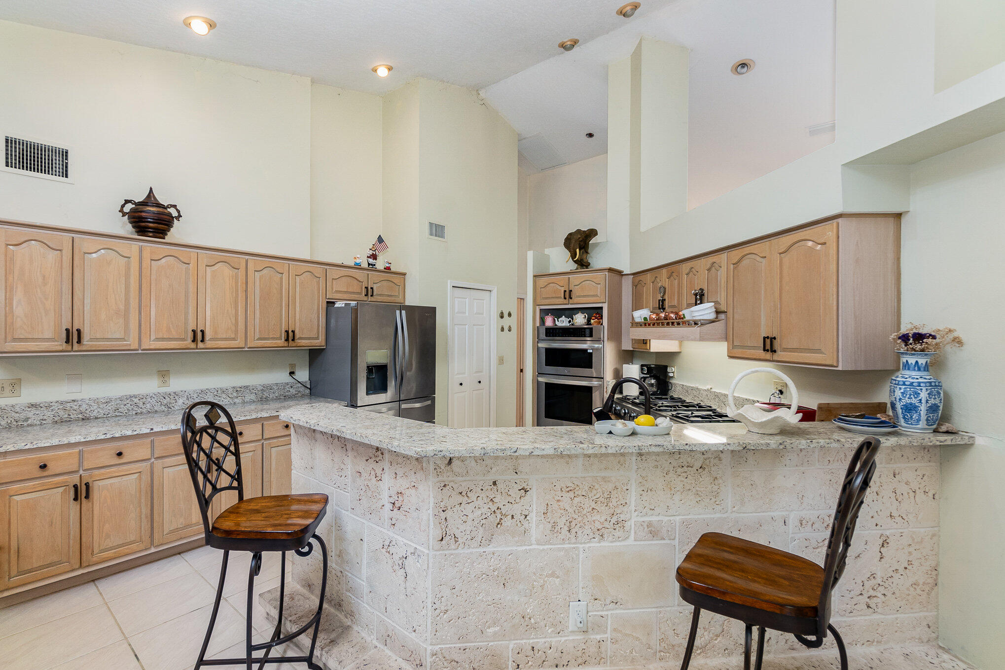 234 Deer Run Road Palm Bay, FL 32909 - Photo 9 of 50 a kitchen with cabinets and chairs