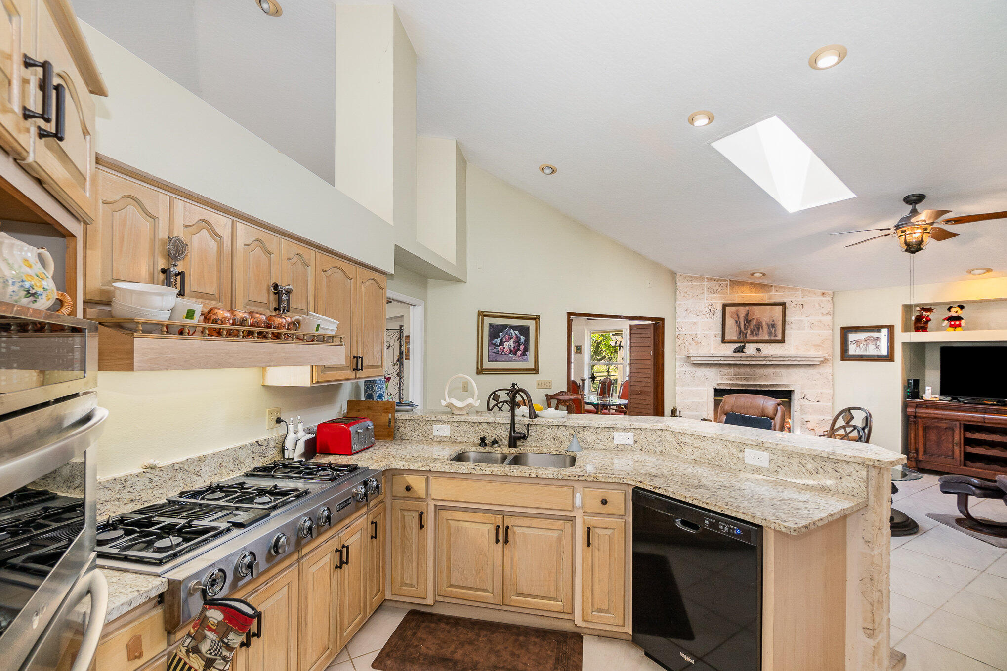 234 Deer Run Road Palm Bay, FL 32909 - Photo 10 of 50 a kitchen with stainless steel appliances granite countertop a stove and cabinets