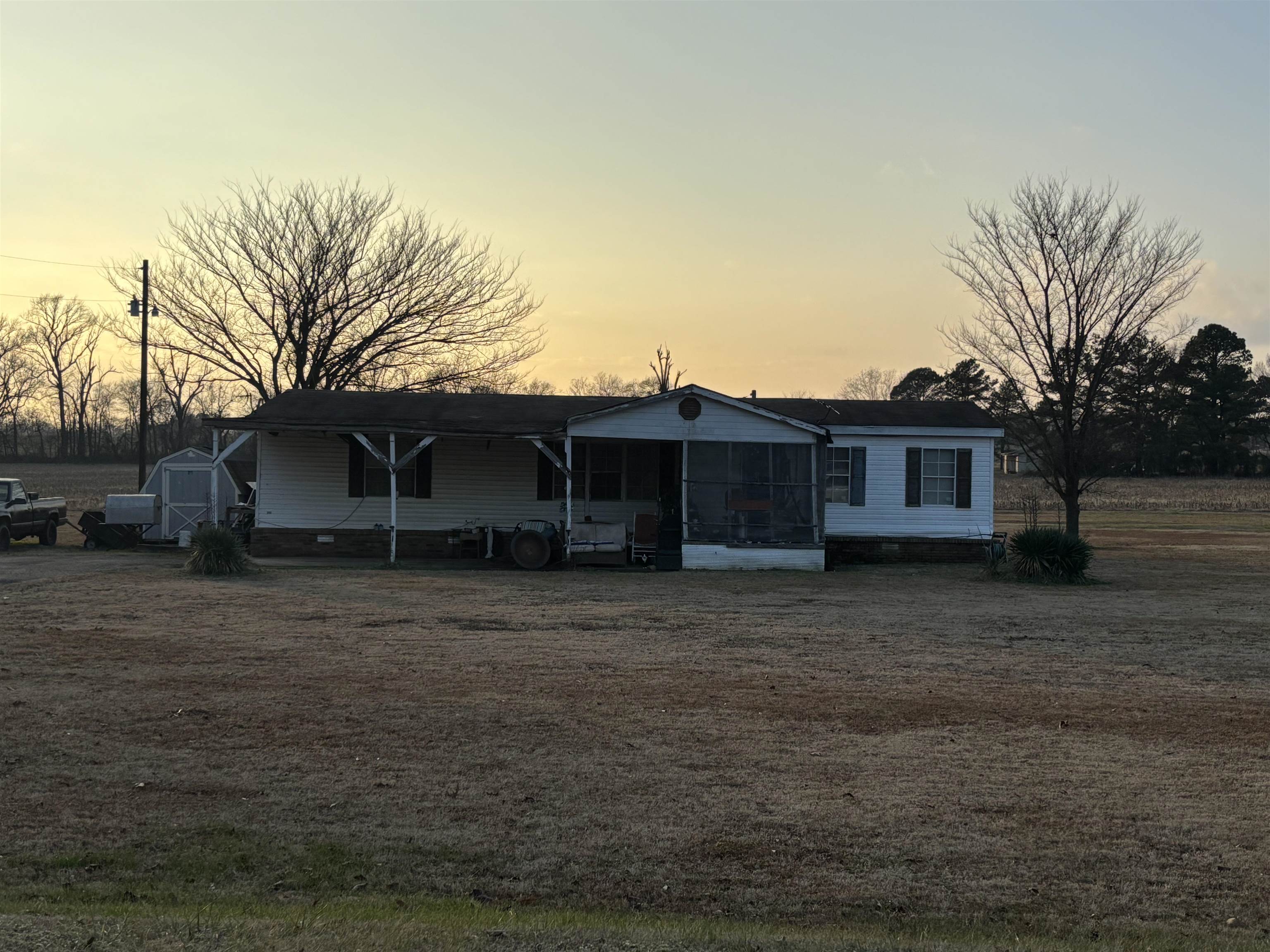 451 Yarbrough Road Covington, TN 38019 - Photo 2 of 2 Manufactured / mobile home with a sunroom and a shed