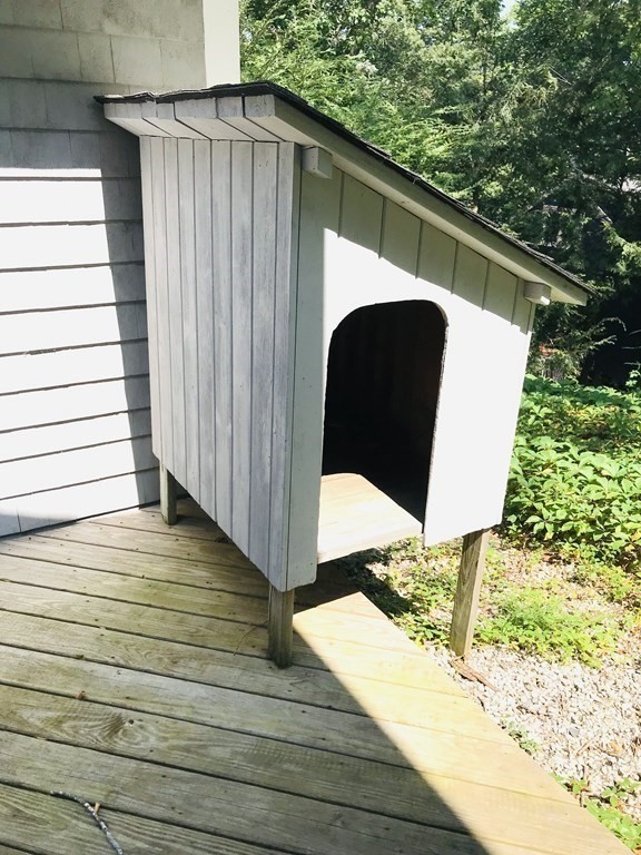 35 Sycamore Road Wayland, MA 01778 - Photo 15 of 42 a view of a balcony with wooden floor and fence