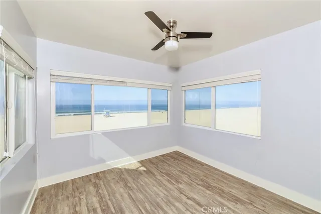 a view of a kitchen with a sink a refrigerator and a fireplace