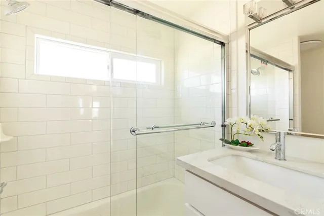 a kitchen with stainless steel appliances a stove a sink and a microwave