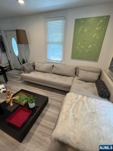 454 Undercliff Avenue Edgewater, NJ 07020 - Photo 2 of 18 a living room with furniture and a large window