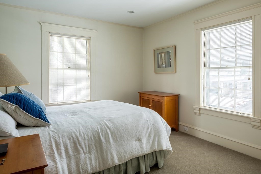 46 Pine Ridge Road Newton, MA 02468 - Photo 11 of 18 a bed sitting in a bedroom next to a window