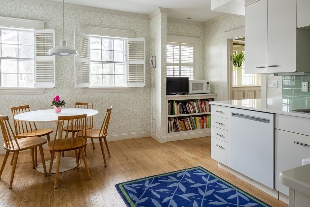46 Pine Ridge Road Newton, MA 02468 - Photo 6 of 18 a view of a dining room with furniture and a book shelf