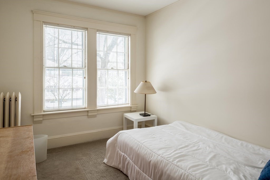 46 Pine Ridge Road Newton, MA 02468 - Photo 10 of 18 a bedroom with a bed and a window
