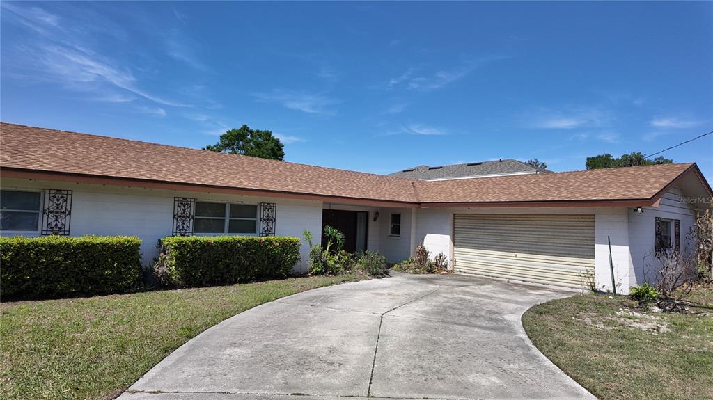 5026 North Socrum Loop Road Lakeland, FL 33809 - Photo 1 of 1 a front view of a house with garden