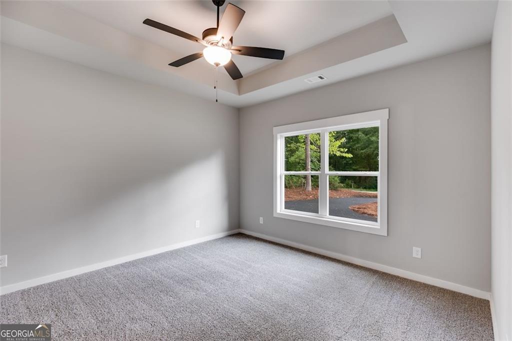 525 Grogan Road Buchanan, GA 30113 - Photo 27 of 40 an empty room with a window and a fan
