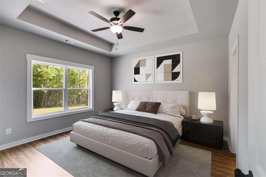 525 Grogan Road Buchanan, GA 30113 - Photo 31 of 40 a bedroom with a large bed and a window