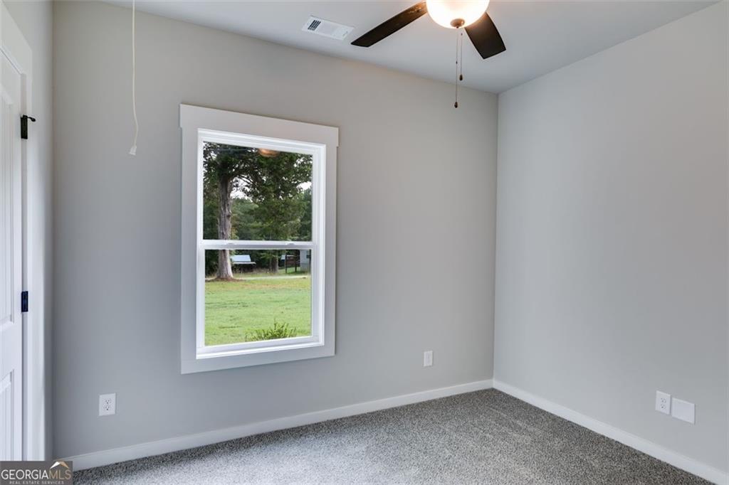 525 Grogan Road Buchanan, GA 30113 - Photo 34 of 40 an empty room with a window