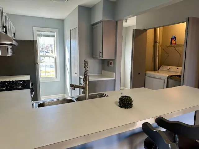 a room with table and chairs