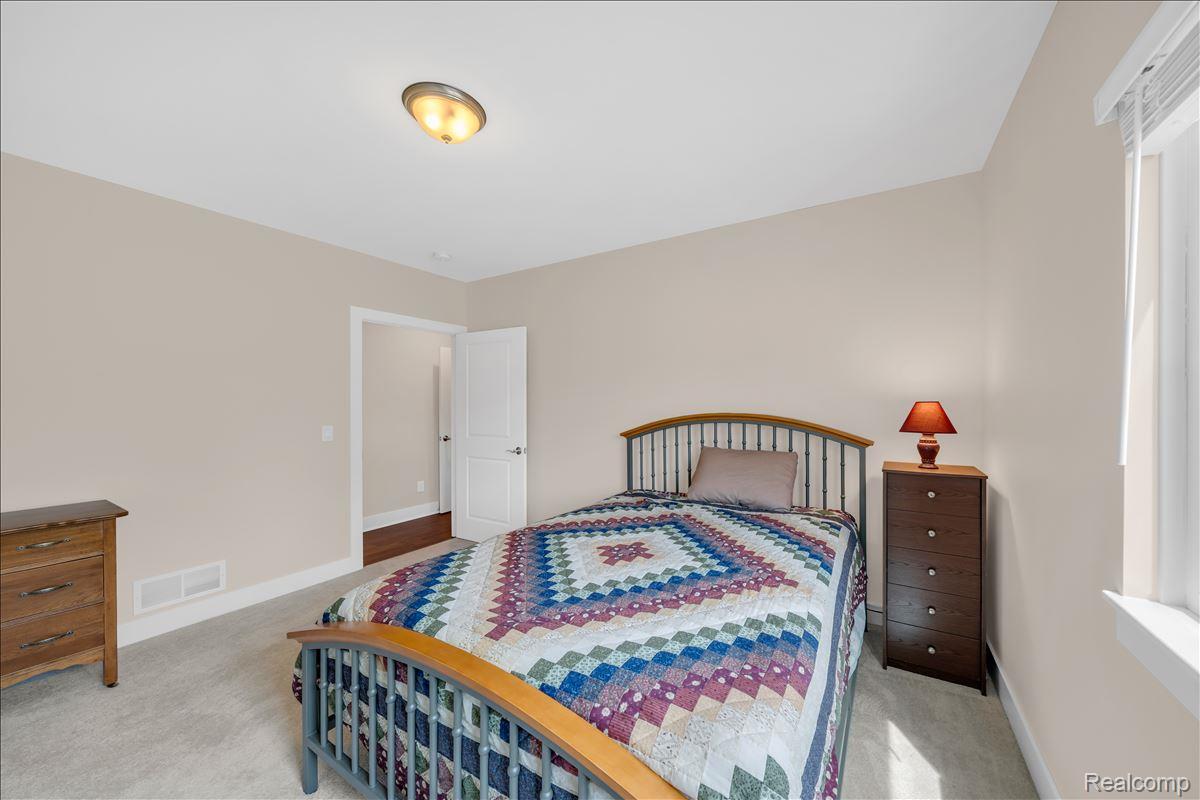 4266 McCandlish Road Grand Blanc, MI 48439 - Photo 46 of 68 Neutral-toned interior room featuring light carpet flooring and white trim