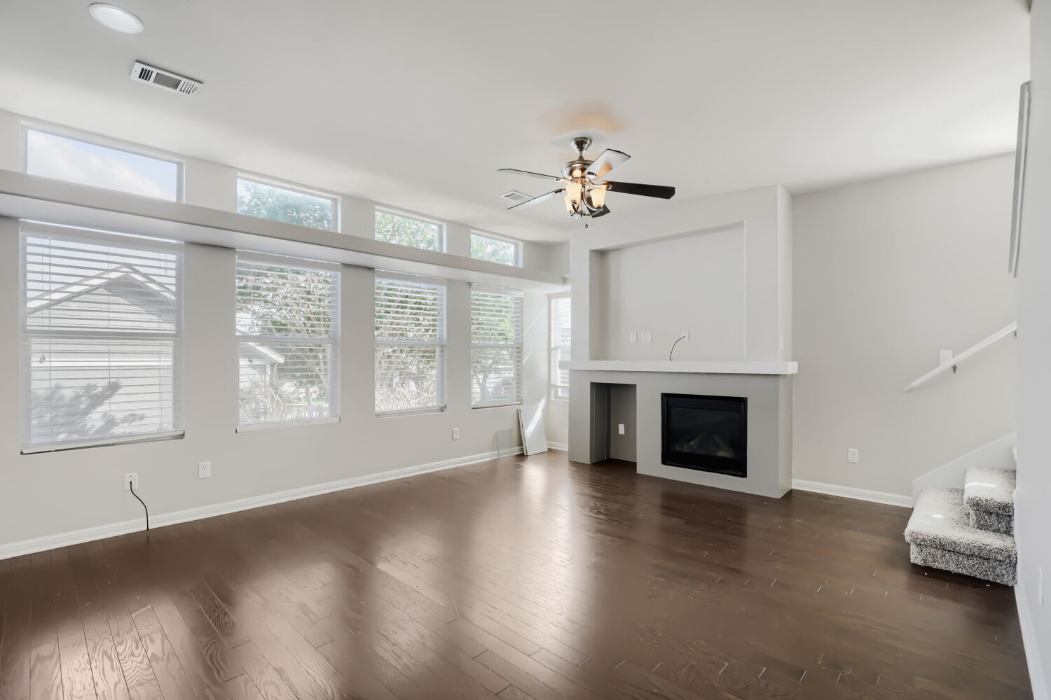 5136 Hellman Kyle, TX 78640 - Photo 12 of 25 a view of livingroom window fireplace and wooden floor
