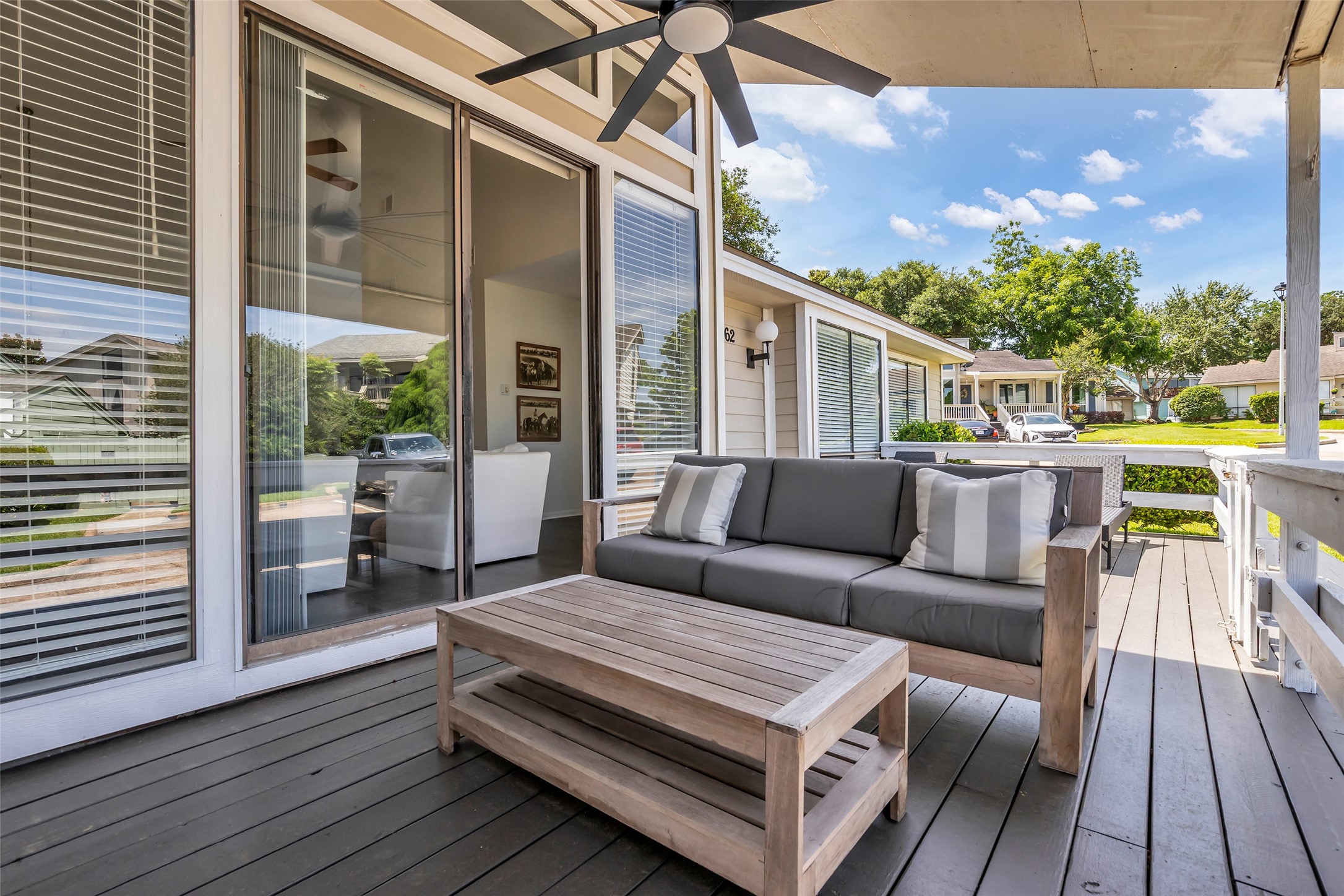62 April Point Drive North Conroe, TX 77356 - Photo 3 of 25 a outdoor living space with furniture and wooden floor