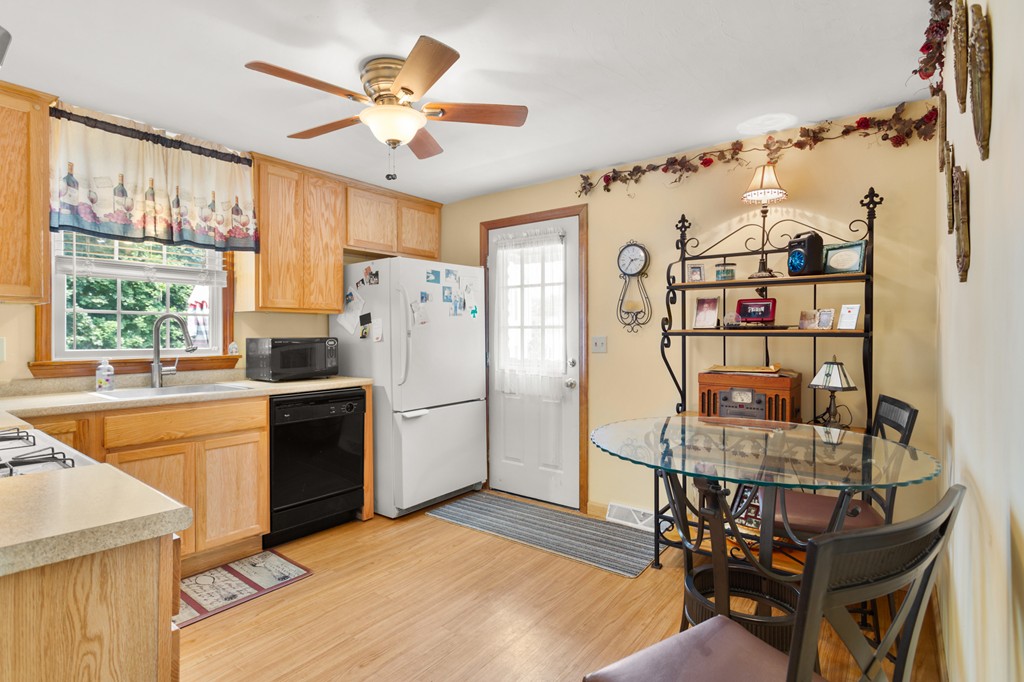 163 Mammoth Road, Unit 163 Lowell, MA 01854 - Photo 12 of 30 a kitchen with stainless steel appliances granite countertop a refrigerator and a stove top oven