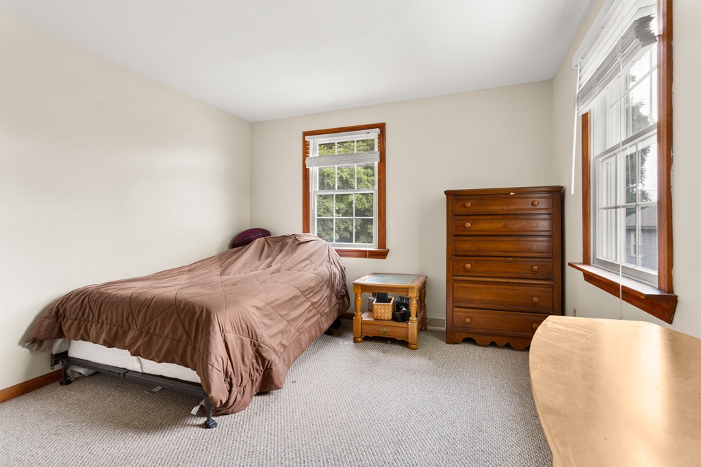 163 Mammoth Road, Unit 163 Lowell, MA 01854 - Photo 18 of 30 a bedroom with a bed and a window