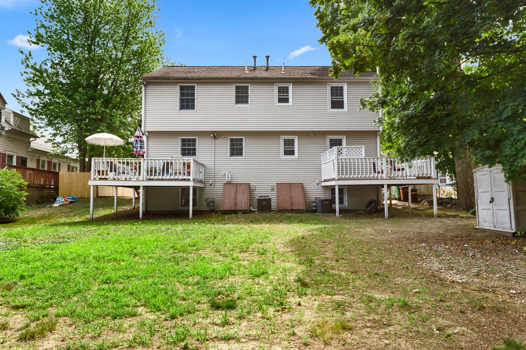 163 Mammoth Road, Unit 163 Lowell, MA 01854 - Photo 3 of 30 a view of a house with a yard