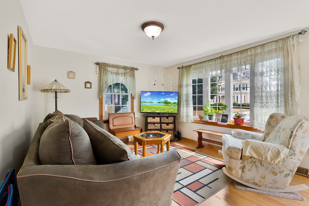 163 Mammoth Road, Unit 163 Lowell, MA 01854 - Photo 7 of 30 a living room with furniture and a large window
