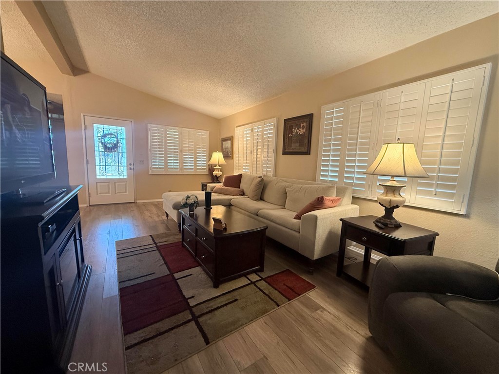 31130 South General Kearny Road, Unit 153 Temecula, CA 92591 - Photo 14 of 38 a living room with furniture and a fireplace