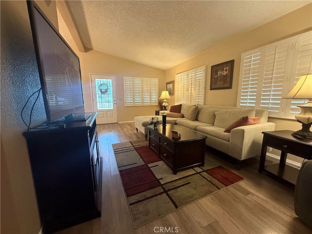 31130 South General Kearny Road, Unit 153 Temecula, CA 92591 - Photo 15 of 38 a living room with furniture and a fireplace