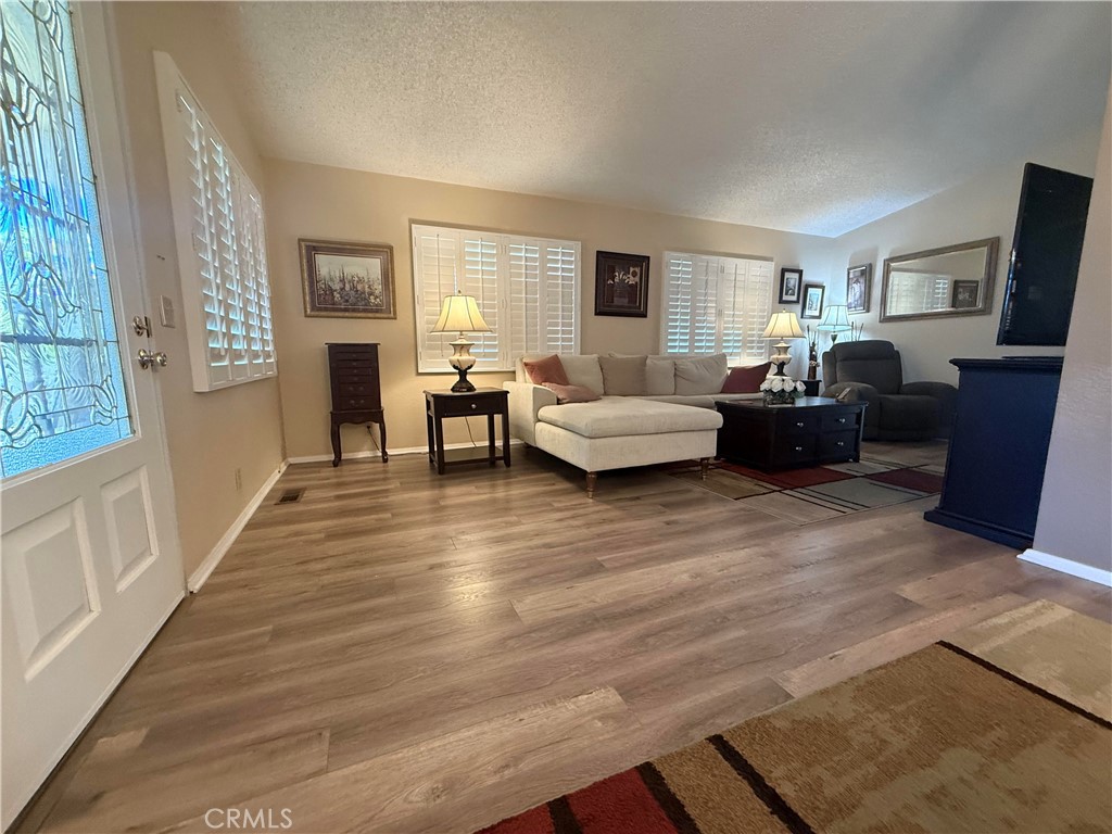 31130 South General Kearny Road, Unit 153 Temecula, CA 92591 - Photo 16 of 38 a living room with furniture and a flat screen tv