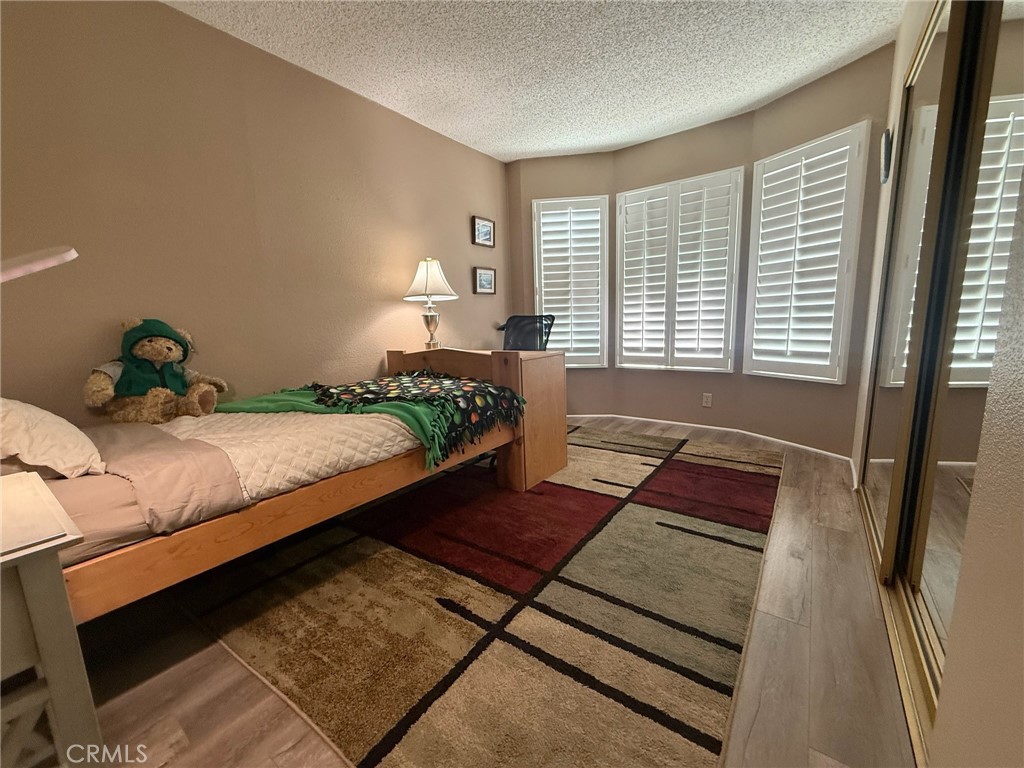 31130 South General Kearny Road, Unit 153 Temecula, CA 92591 - Photo 24 of 38 a bedroom with a bed window and lamp