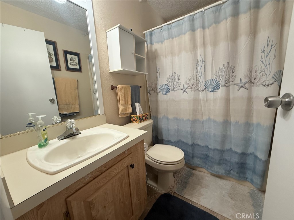 31130 South General Kearny Road, Unit 153 Temecula, CA 92591 - Photo 26 of 38 a bathroom with a sink and a mirror