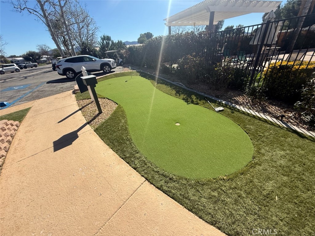 31130 South General Kearny Road, Unit 153 Temecula, CA 92591 - Photo 38 of 38 a view of a swimming pool with a bench and trees