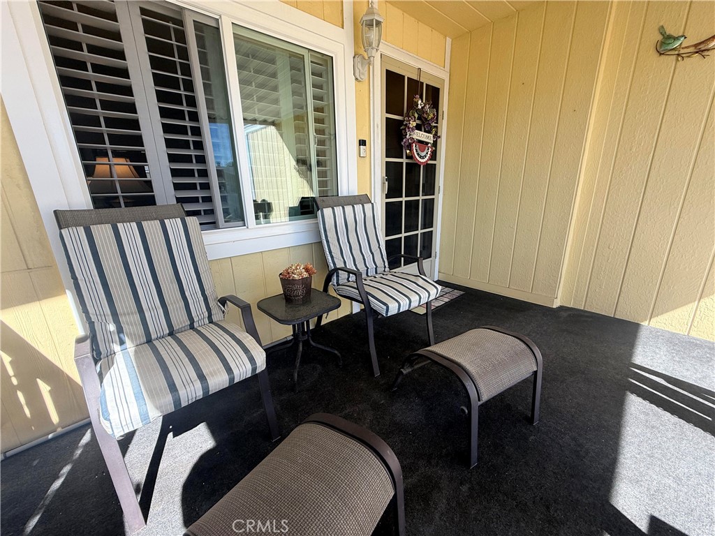 31130 South General Kearny Road, Unit 153 Temecula, CA 92591 - Photo 5 of 38 a balcony with table and chairs