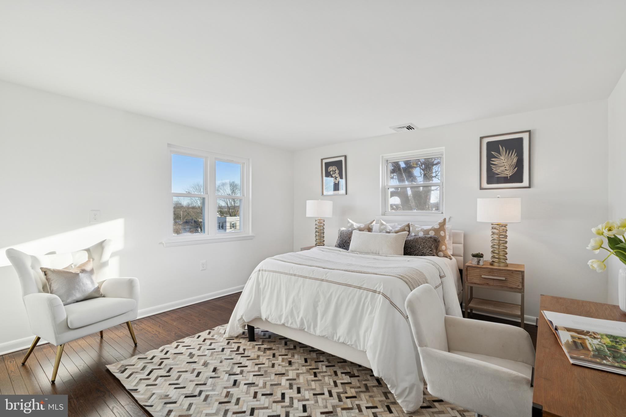 303 Lemon Street Pottstown, PA 19464 - Photo 12 of 15 a bedroom with a bed and wooden floor