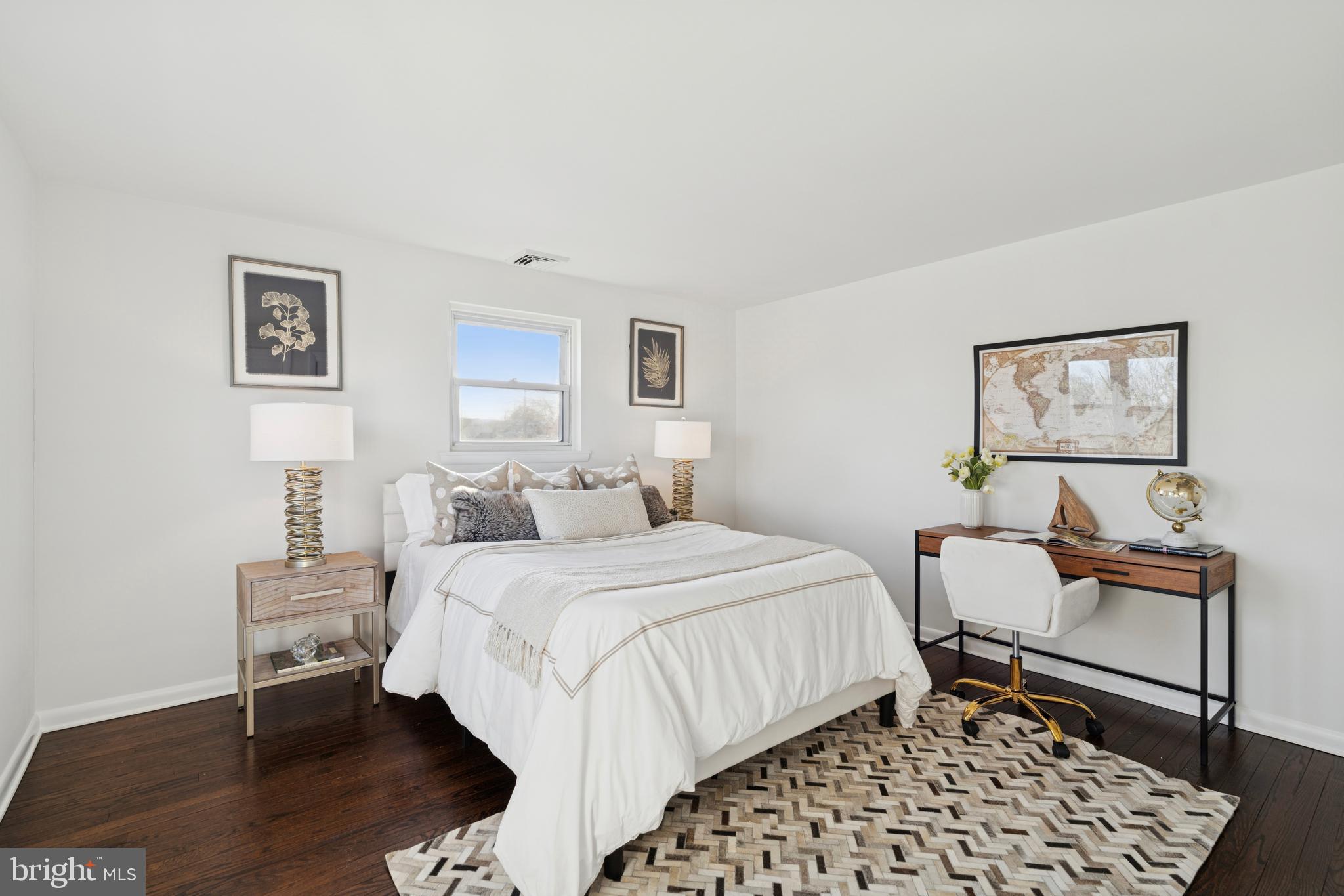 303 Lemon Street Pottstown, PA 19464 - Photo 13 of 15 a bedroom with a bed and a chair