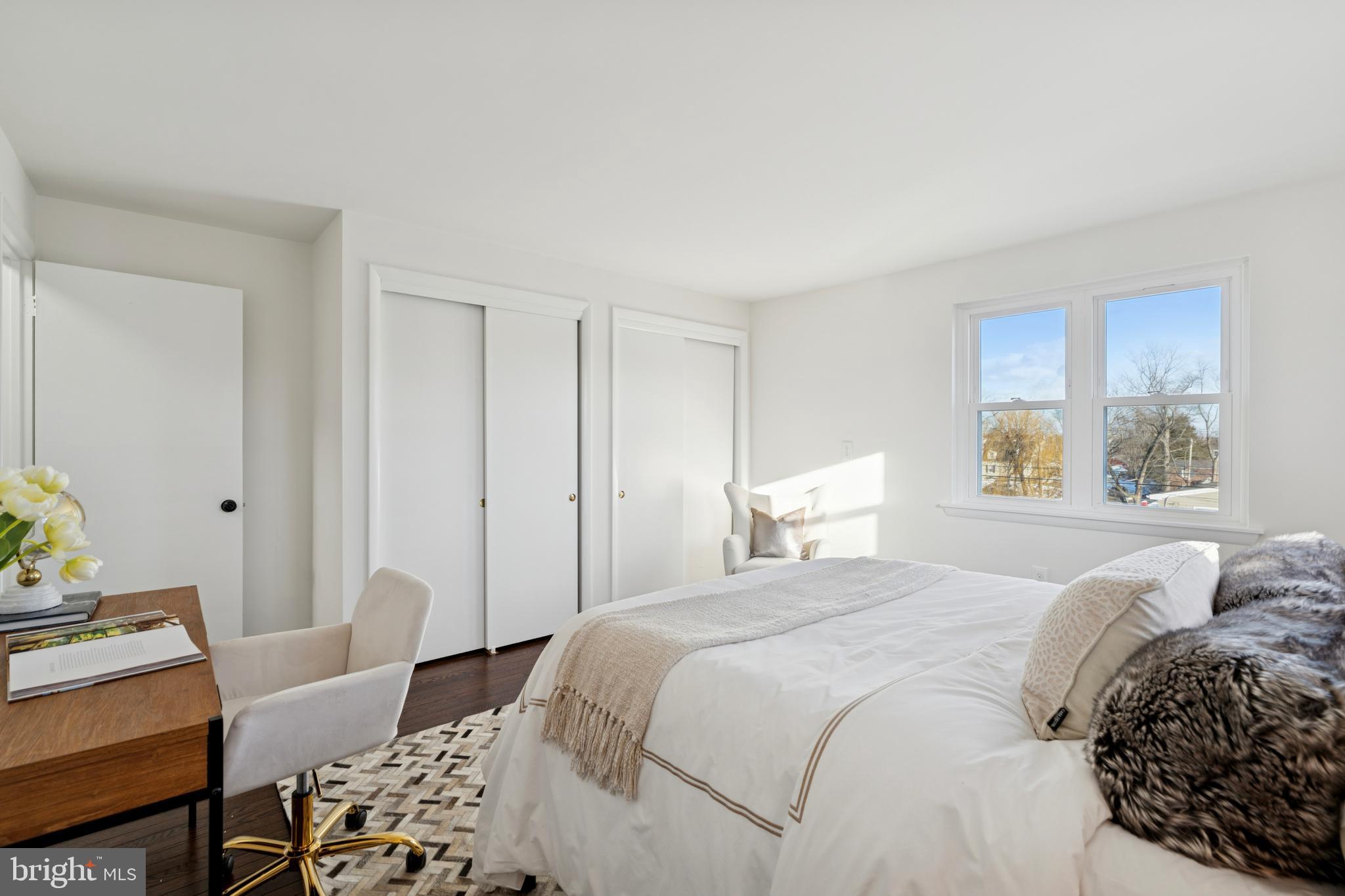 303 Lemon Street Pottstown, PA 19464 - Photo 14 of 15 a bedroom with a bed and wooden floor