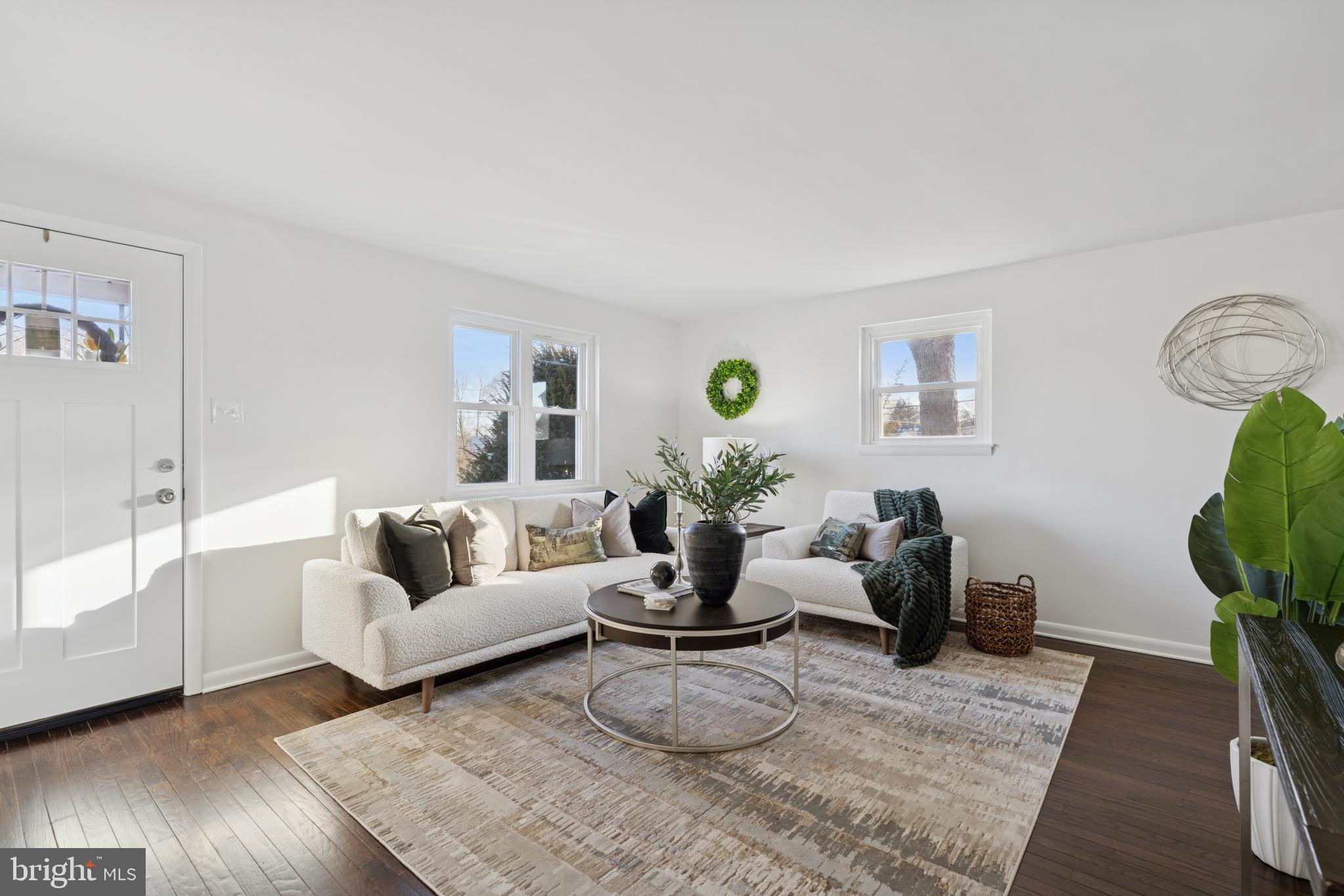 303 Lemon Street Pottstown, PA 19464 - Photo 2 of 15 a living room with furniture and wooden floor