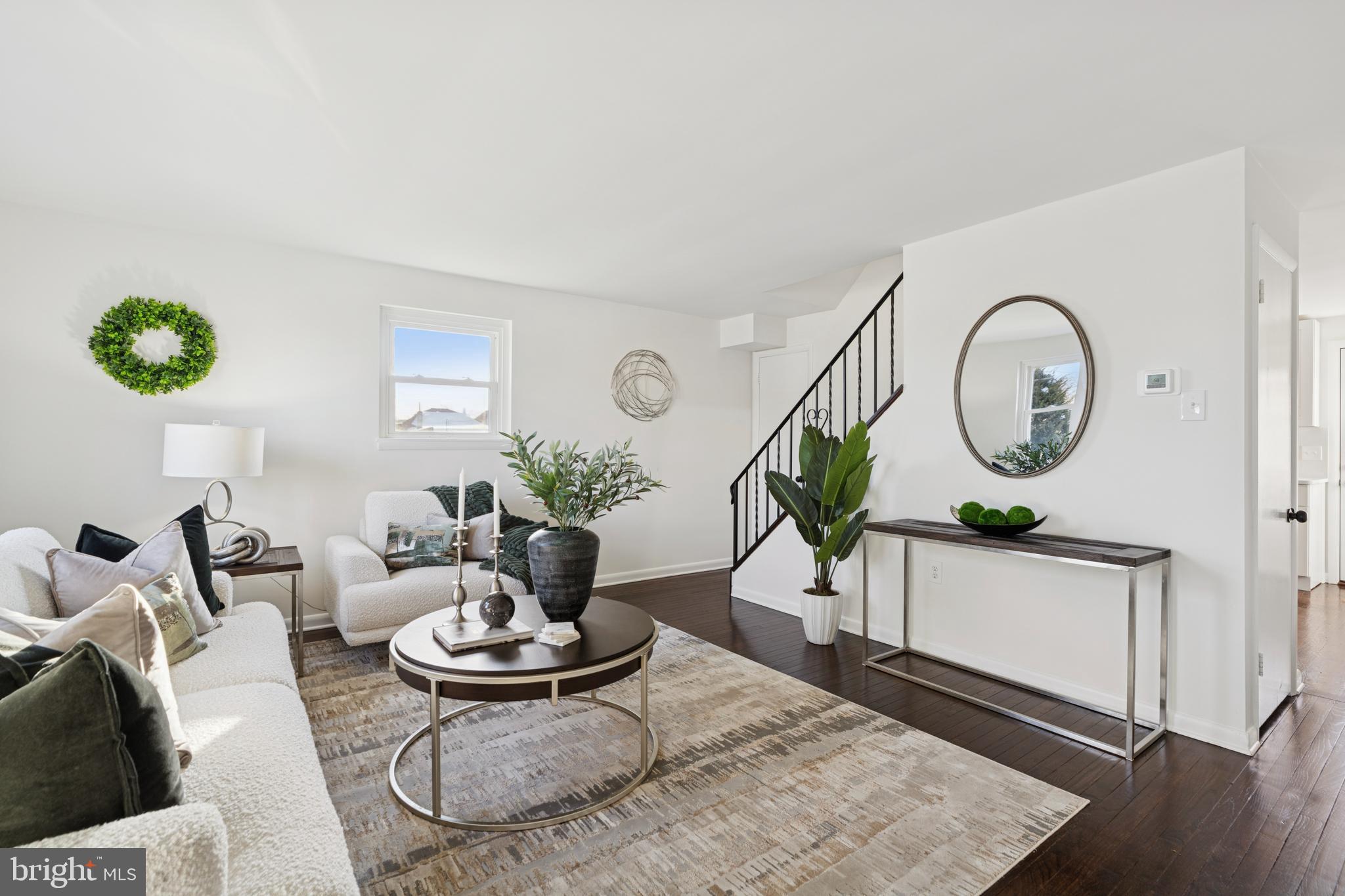 303 Lemon Street Pottstown, PA 19464 - Photo 3 of 15 a living room with furniture and a mirror