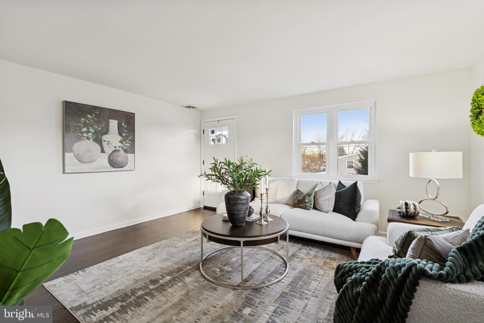 303 Lemon Street Pottstown, PA 19464 - Photo 4 of 15 a living room with furniture or couch and a potted plant