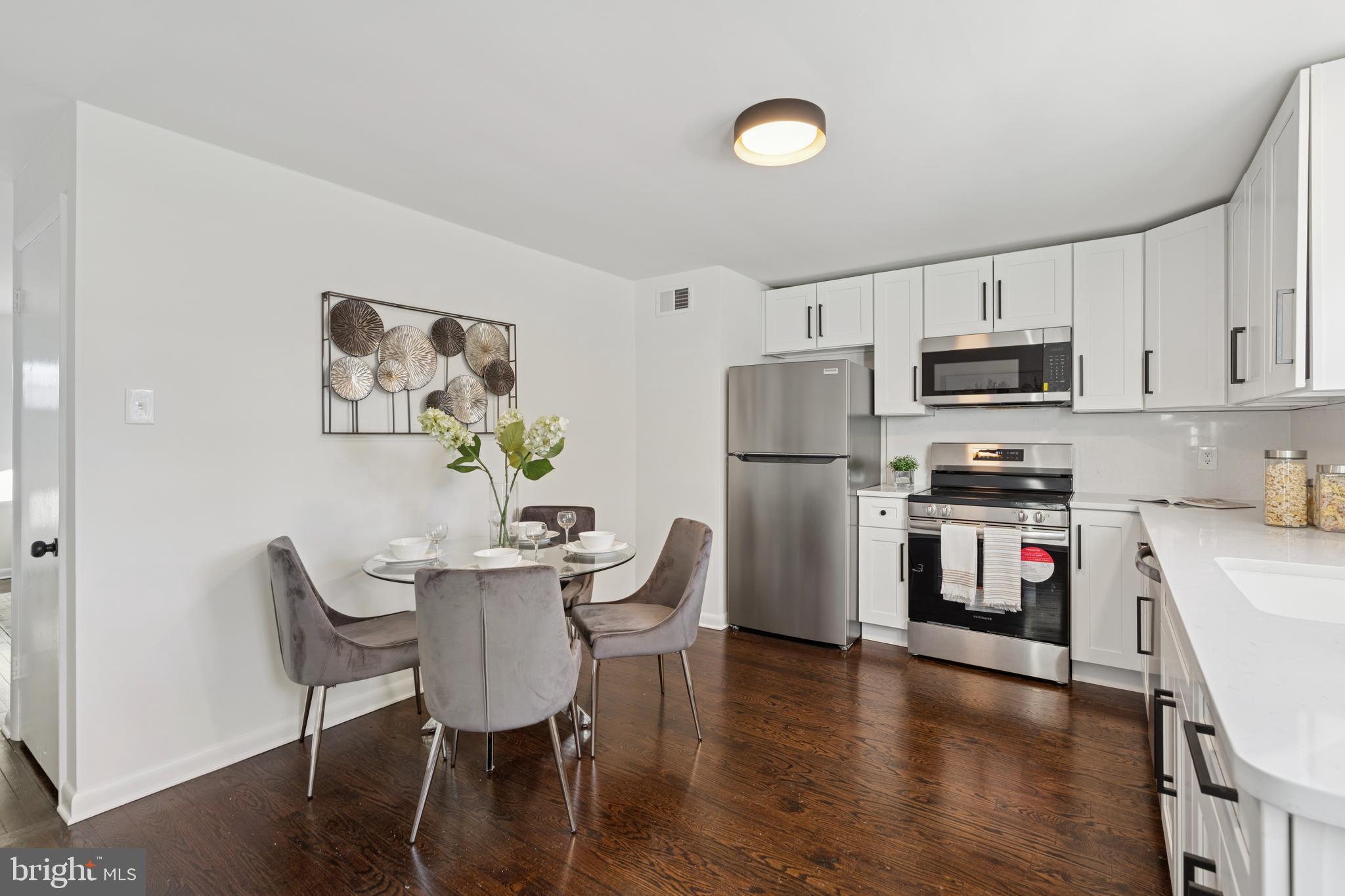 303 Lemon Street Pottstown, PA 19464 - Photo 7 of 15 a kitchen with stainless steel appliances a refrigerator stove microwave and cabinets