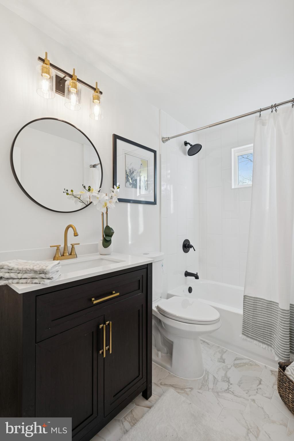303 Lemon Street Pottstown, PA 19464 - Photo 10 of 15 a bathroom with a toilet a sink and mirror