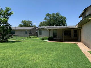 1809 West 19th Plainview, TX 79072 - Photo 16 of 19 a front view of a house with a garden