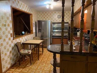 a dining room with furniture and window