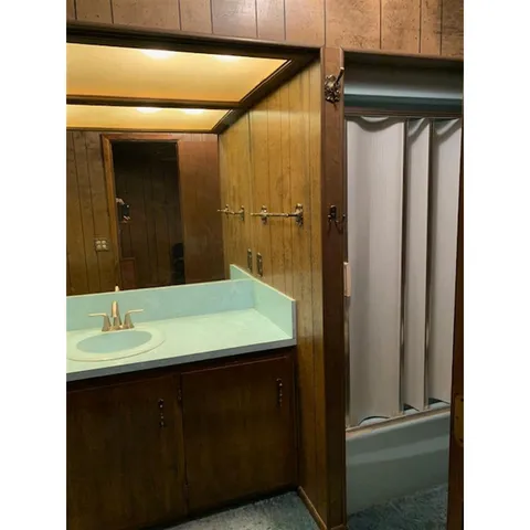 a bathroom with a sink and a mirror